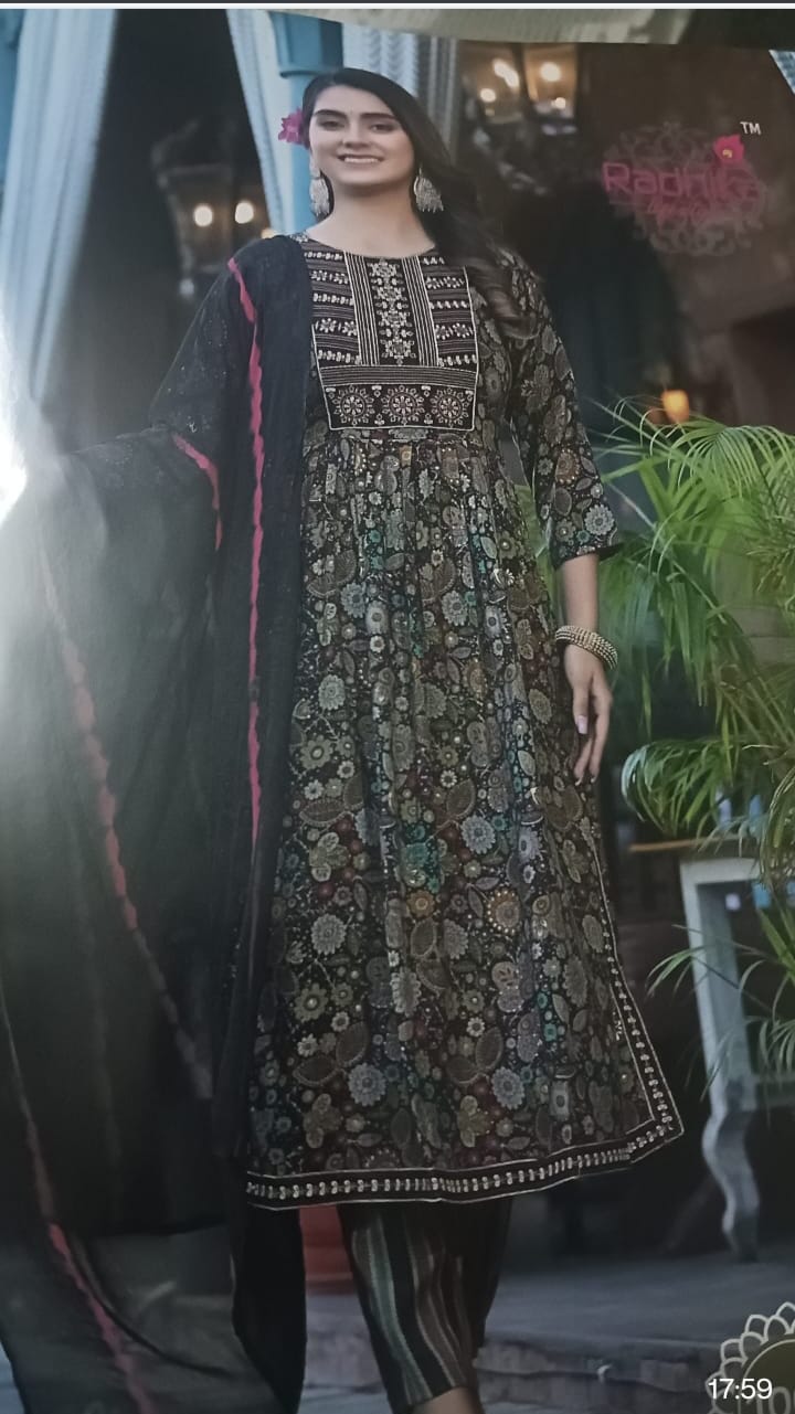 Woman wearing a traditional embroidered dress in an indoor setting